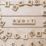AUDIT text on wooden cubes on wooden background